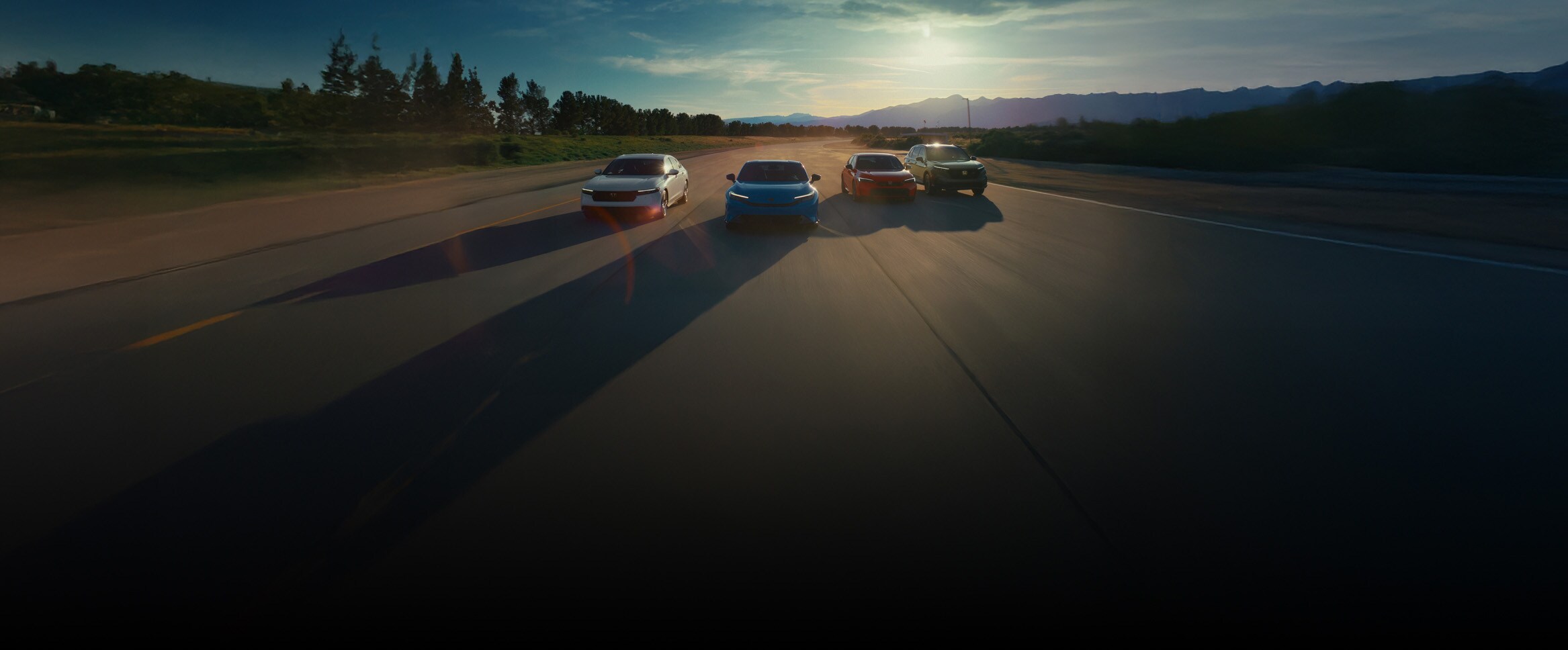 2026 Accord Touring Hybrid shown in Platinum White Pearl, 2026 Prelude Hybrid in Boost Blue Pearl, 2026 Civic Sedan Sport Touring Hybrid in Rallye Red, and 2026 CR-V TrailSport Hybrid in Ash Green Metallic.