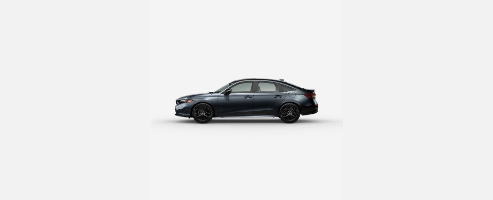 2026 Honda Civic Sedan Sport Hybrid in Meteorite Gray Metallic profile parked in a clean white studio setting (Compact Sedan). 2026 Honda Civic Sedan Sport Hybrid in Meteorite Gray Metallic profile parked in a clean white studio setting (Compact Sedan).