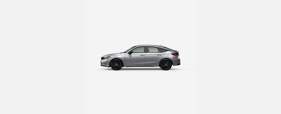 2026 Honda Civic Hatchback Sport in Solar Silver Metallic profile parked in a clean white studio setting (Compact Hatchback). 2026 Honda Civic Hatchback Sport in Solar Silver Metallic profile parked in a clean white studio setting (Compact Hatchback).