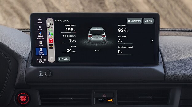 2026 Honda Passport TrailSport front displayed on a smartphone screen held by a person in a forest.