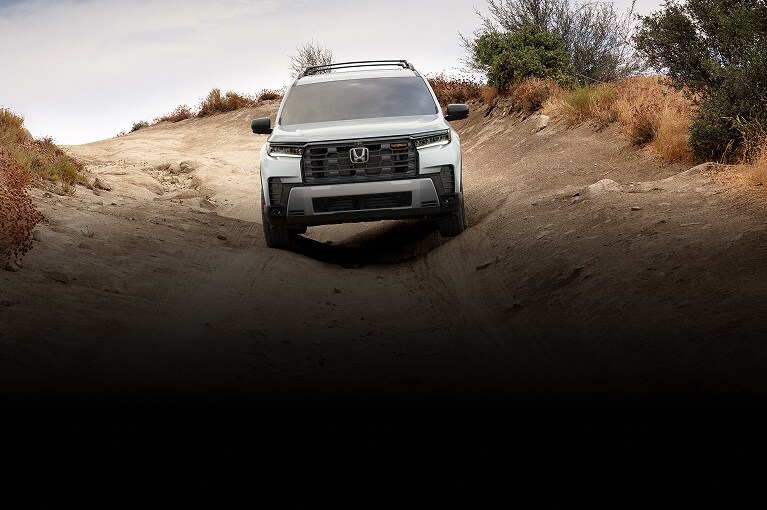 2026 Honda Pilot TrailSport shown in Solar Silver Metallic with Honda Genuine Accessories