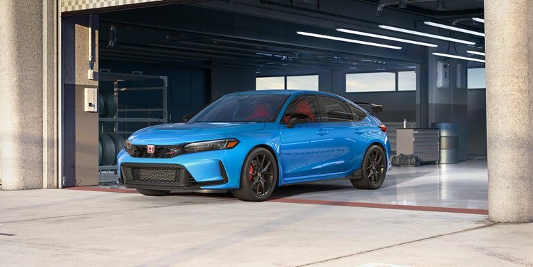 2026 Honda Civic Type R in Boot Blue Pearl parked in a garage