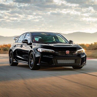 2026 Honda Civic Type R in Crystal Black Pearl driving on a race track