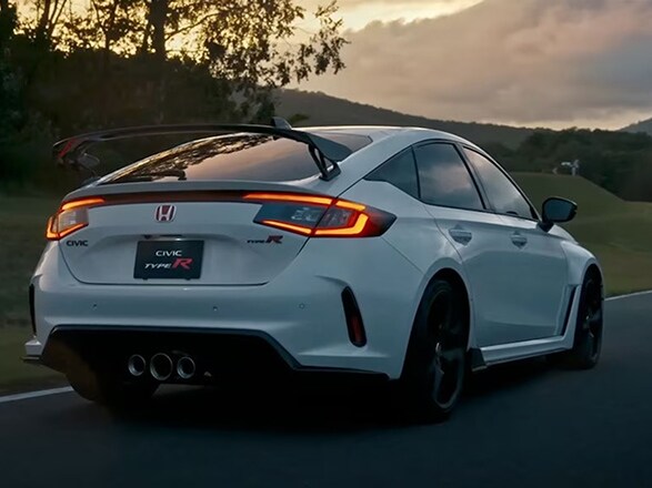 2026 Honda Civic Type R in Championship White driving greenery on the background